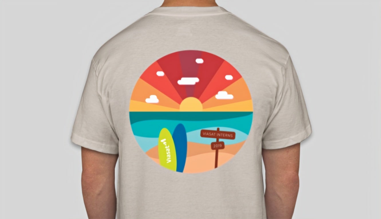 mockup of tan tshirt with circular graphic of a sunset and surfboards on the back side